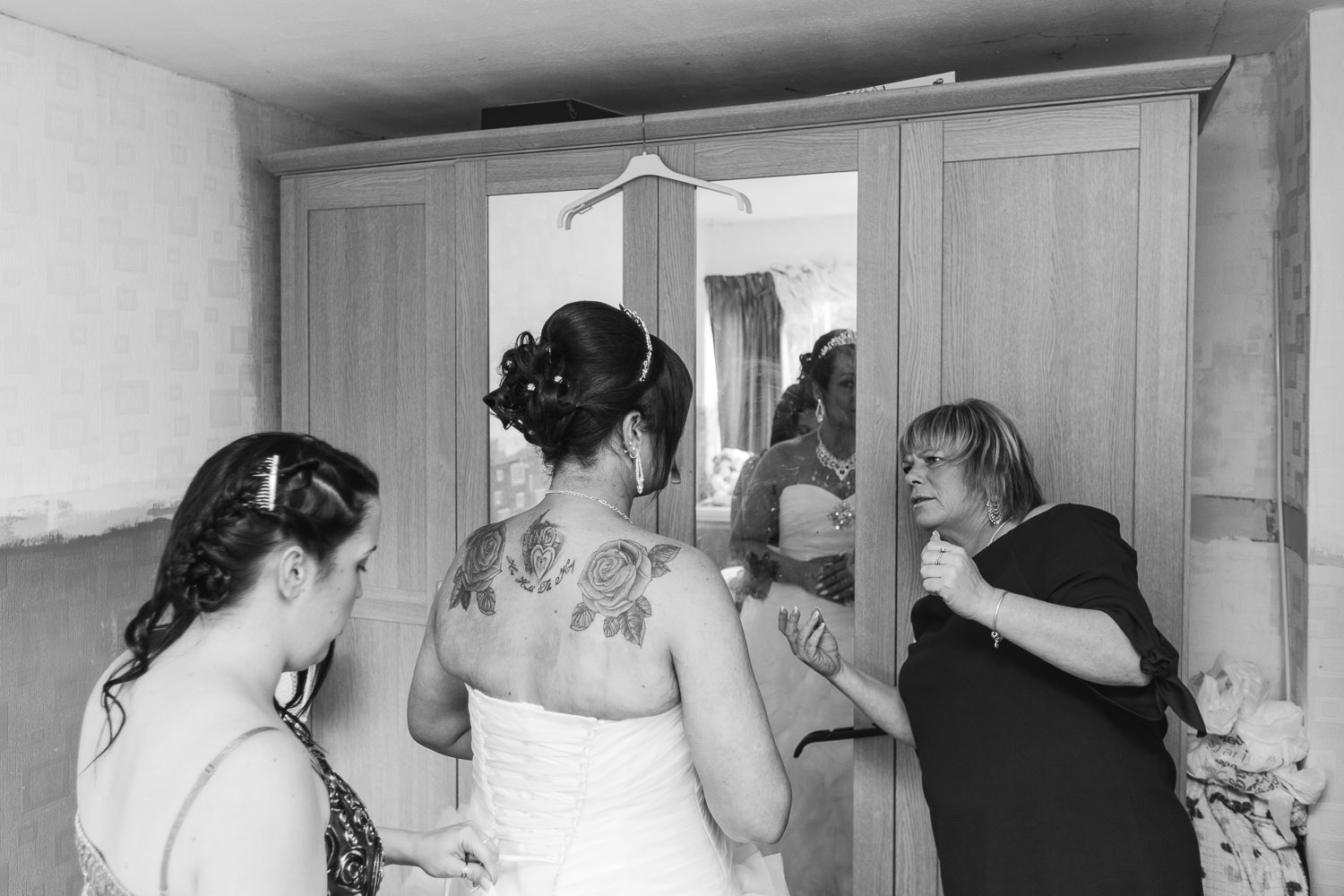 bridal party helps the bride prepare for her special wedding day