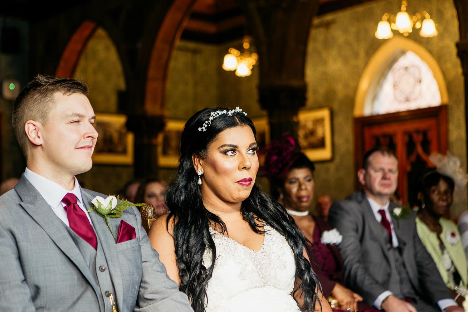 bride and groom listen to birmingham registrars during ceremony