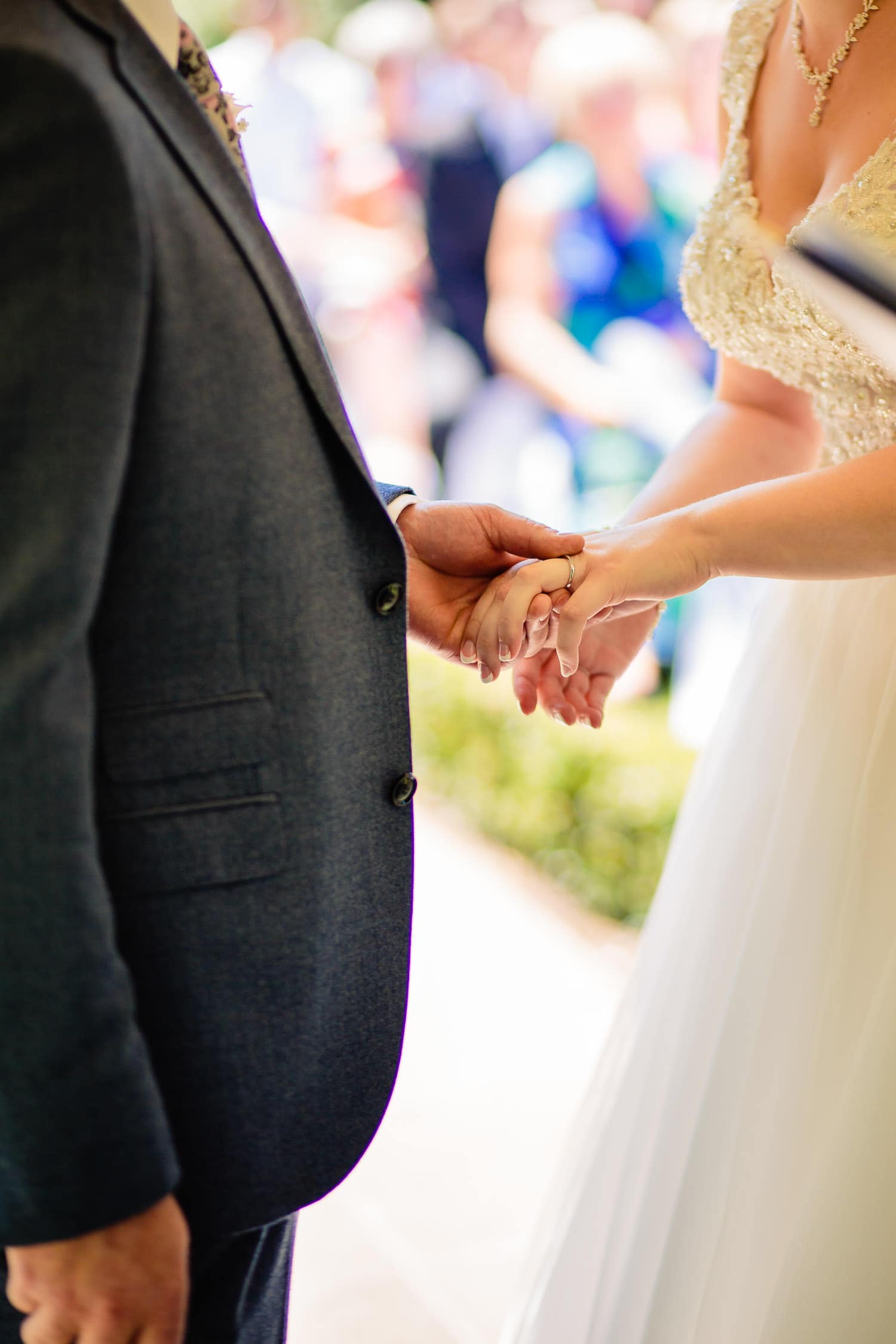 the exchange of wedding rings captured by Warwick House Wedding Photography