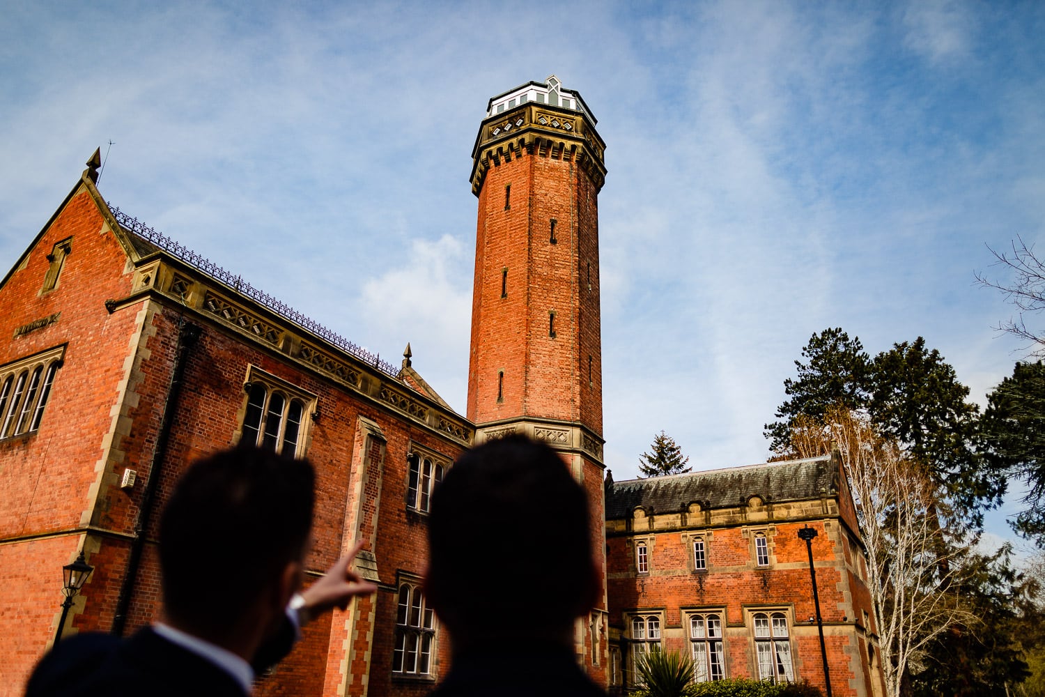 Groom and best man looking at cropston pumping station in Leicestershire