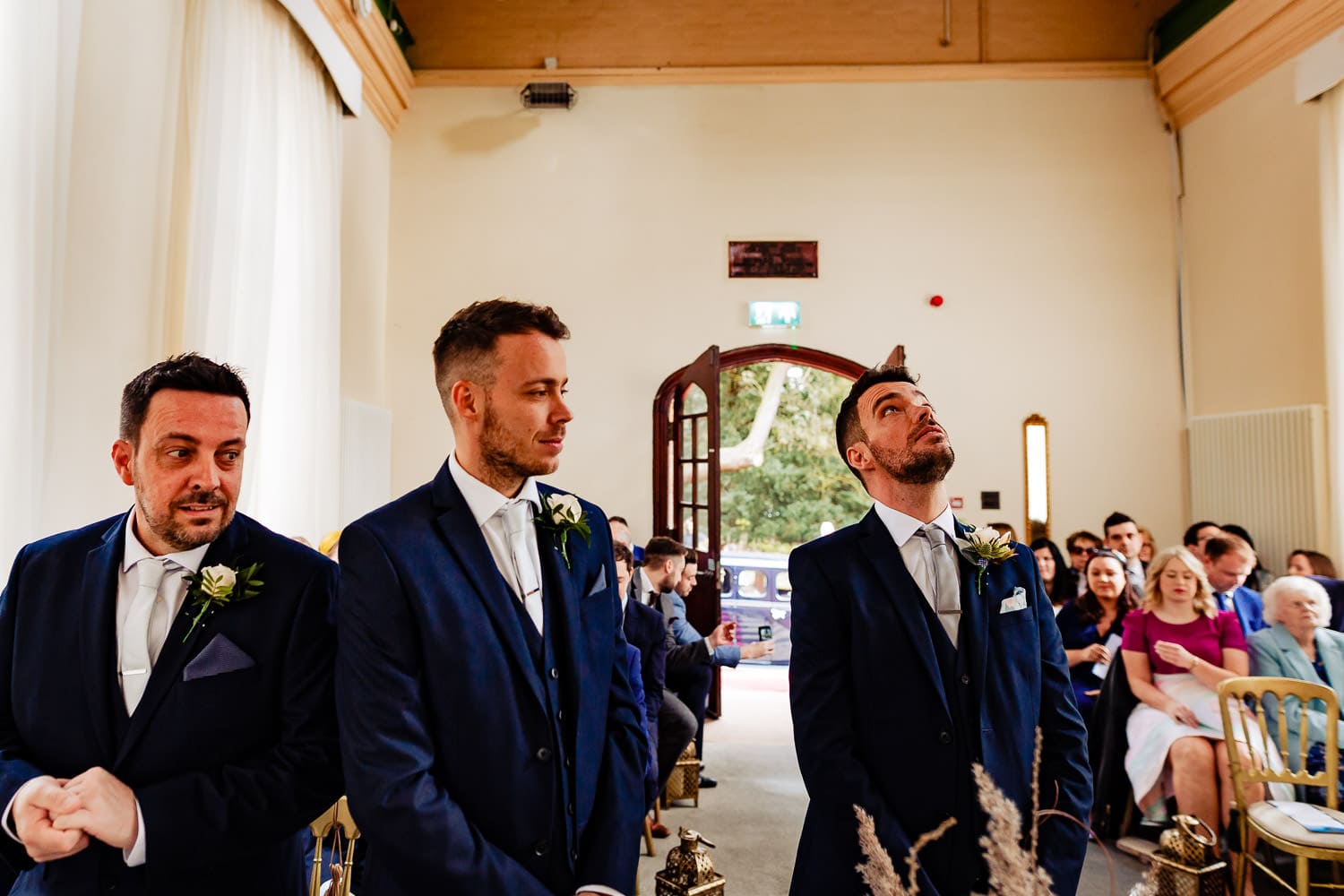 Groom with his brothers look nervous during ceremony