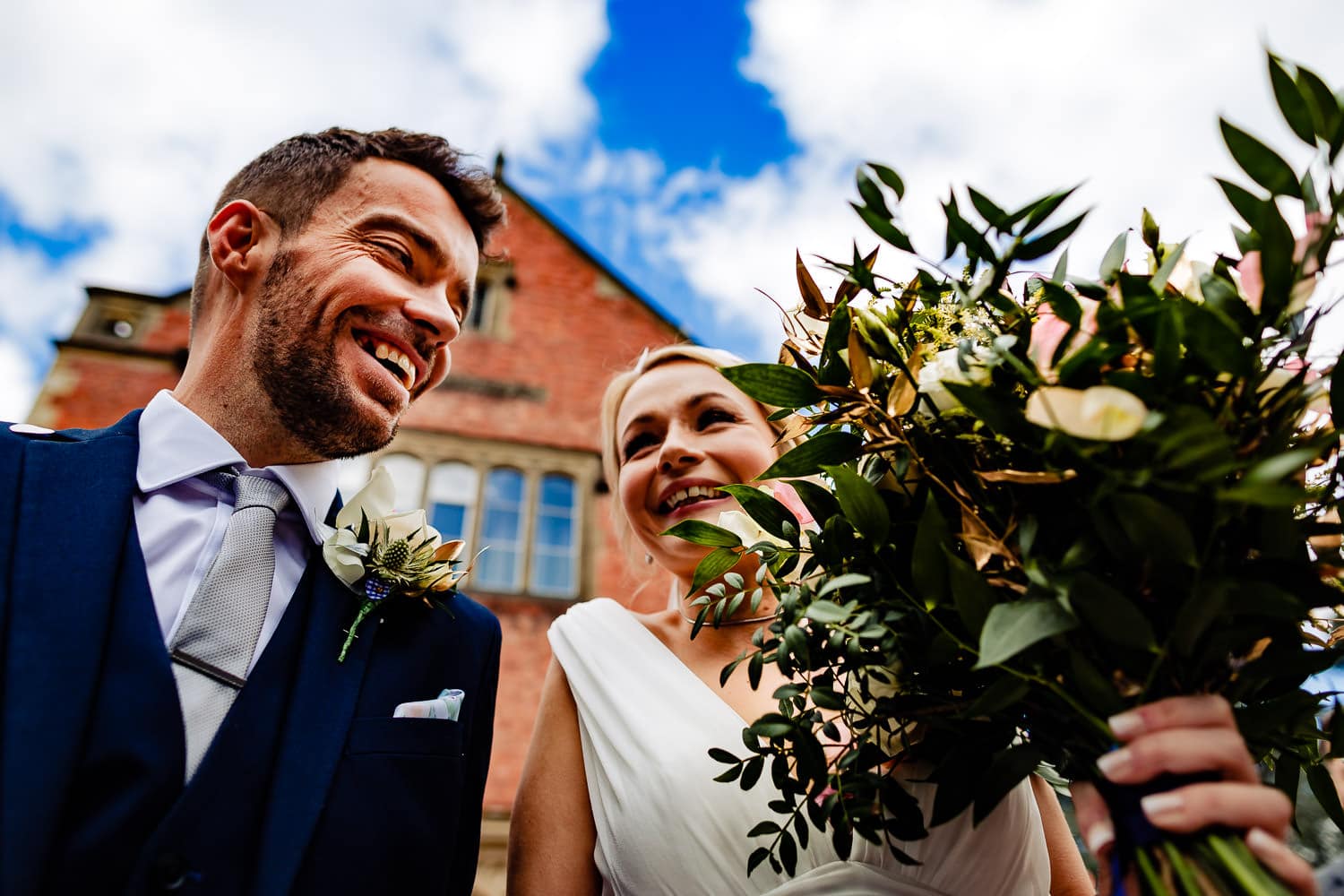 Bride and groom smile to each other after being married in a beautiful wedding in Leicestershire - captured by Chapter One Photography