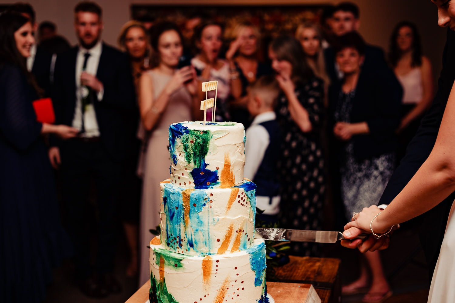 Bride and groom cut the cake during The Old Stables Swithland wedding