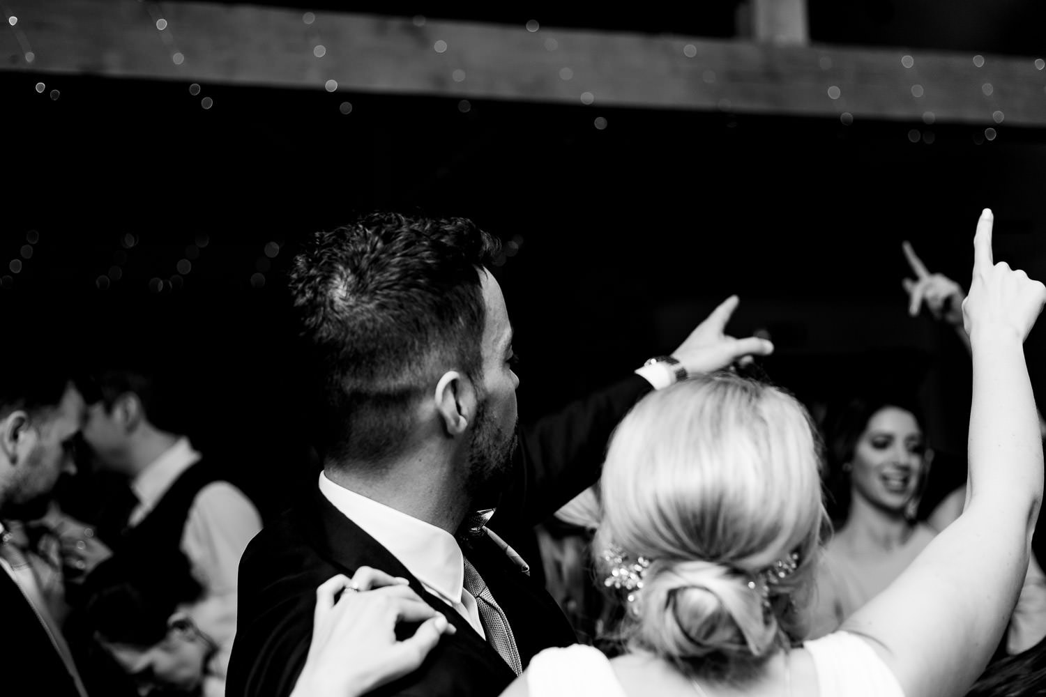 Bride and Groom dance with guests during the wedding reception at the griffin inn swithland